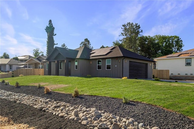 5399 Hickory Way, Paradise, CA 95969 - back of house featuring roof mounted solar panels, an attached garage, board and batten siding, and a residential view