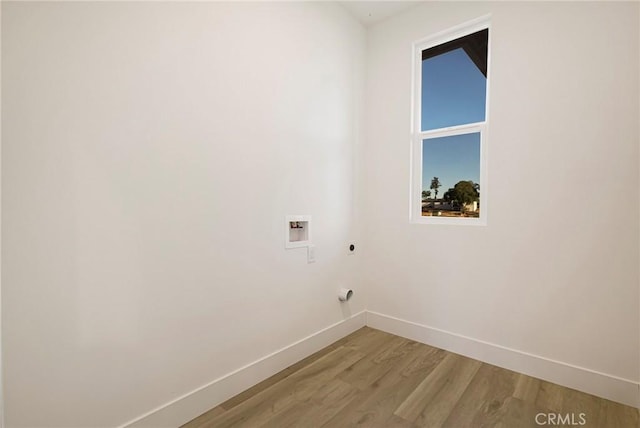 5399 Hickory Way, Paradise, CA 95969 - washroom featuring electric dryer hookup, baseboards, light wood finished floors, and washer hookup