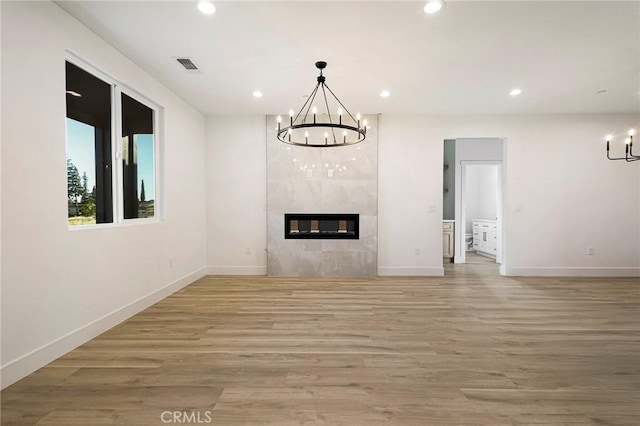 5399 Hickory Way, Paradise, CA 95969 - unfurnished living room featuring a chandelier, baseboards, recessed lighting, and light wood finished floors