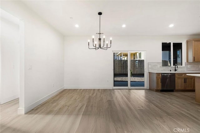 5399 Hickory Way, Paradise, CA 95969 - unfurnished dining area with light wood-style flooring, a sink, a chandelier, recessed lighting, and baseboards