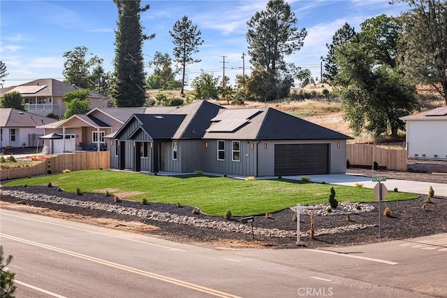 5399 Hickory Way, Paradise, CA 95969 - view of front of house with driveway, solar panels, board and batten siding, and a garage