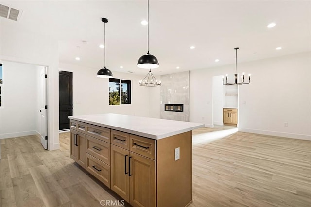 5399 Hickory Way, Paradise, CA 95969 - kitchen featuring a chandelier, light wood-style flooring, a kitchen island, recessed lighting, and light countertops
