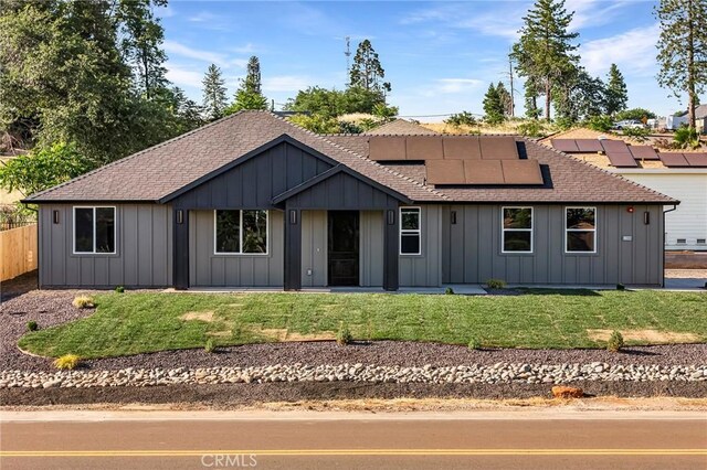 5399 Hickory Way, Paradise, CA 95969 - view of front of property with roof with shingles, board and batten siding, and roof mounted solar panels