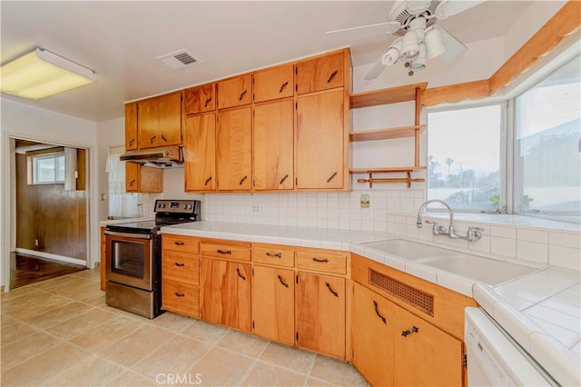 7236 Hellman Ave, Rancho Cucamonga, CA 91701 - kitchen featuring stainless steel electric stove, open shelves, dishwasher, under cabinet range hood, and ceiling fan