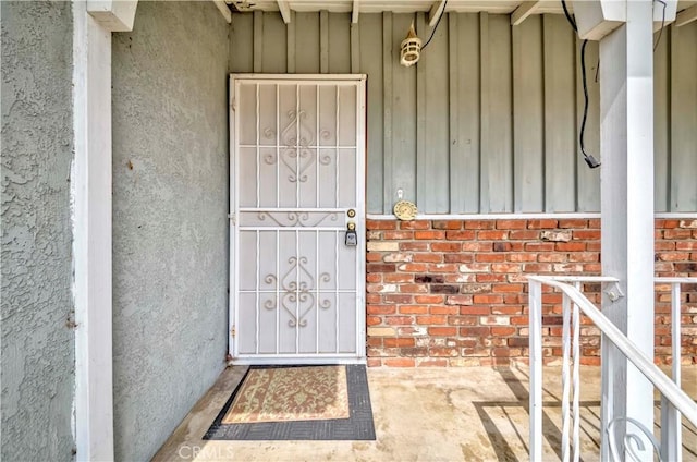 7236 Hellman Ave, Rancho Cucamonga, CA 91701 - view of exterior entry featuring board and batten siding, brick siding, and stucco siding