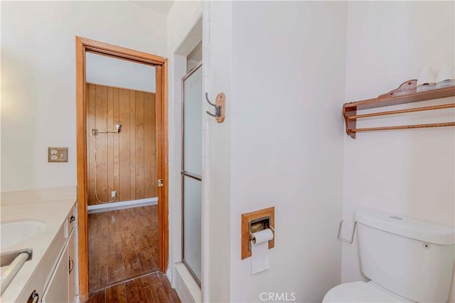 7236 Hellman Ave, Rancho Cucamonga, CA 91701 - bathroom with vanity, a shower stall, wood finished floors, and toilet
