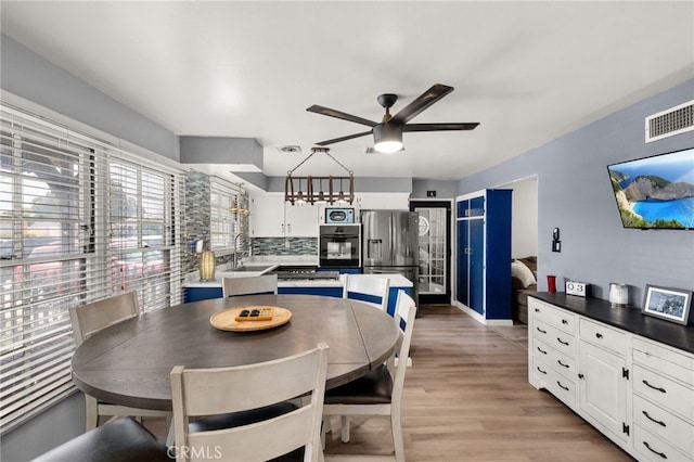 5015 Berryhill Pl, Riverside, CA 92507 - dining room with ceiling fan and light wood-type flooring