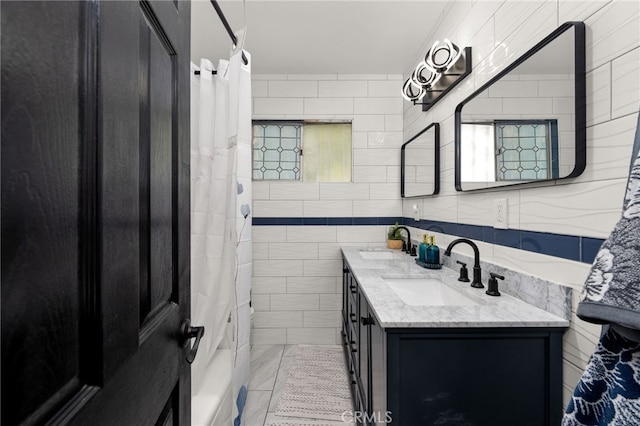 5015 Berryhill Pl, Riverside, CA 92507 - full bathroom featuring double vanity and tile walls
