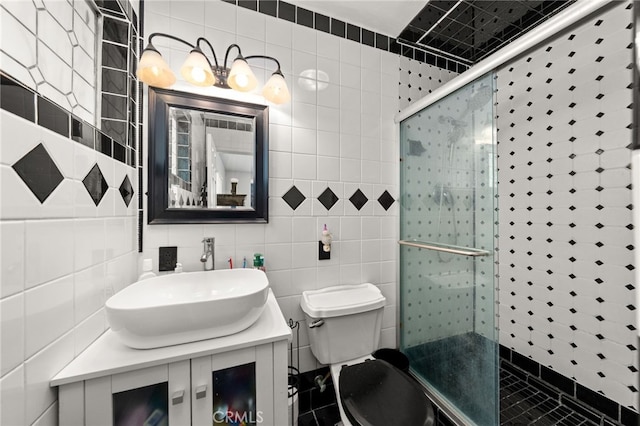 5015 Berryhill Pl, Riverside, CA 92507 - full bathroom with vanity, tile walls, a shower stall, and toilet