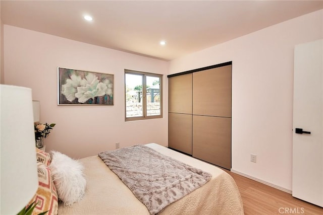 9539 Gladbeck Ave, Northridge, CA 91324 - bedroom featuring light wood finished floors, recessed lighting, and a closet