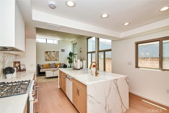9539 Gladbeck Ave, Northridge, CA 91324 - kitchen featuring stainless steel gas range oven, dishwasher, a sink, light wood-style floors, and recessed lighting