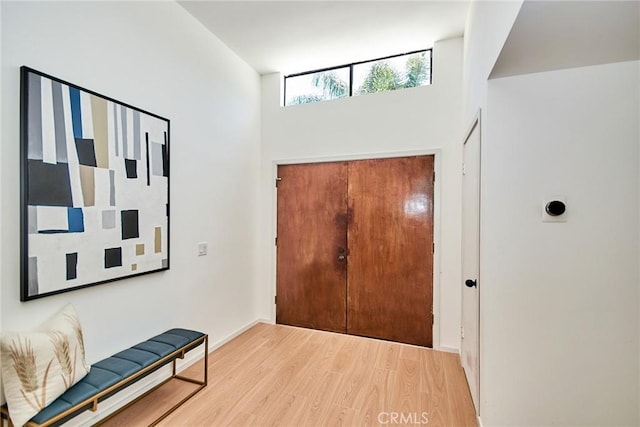 9539 Gladbeck Ave, Northridge, CA 91324 - entrance foyer featuring light wood finished floors, a towering ceiling, and baseboards