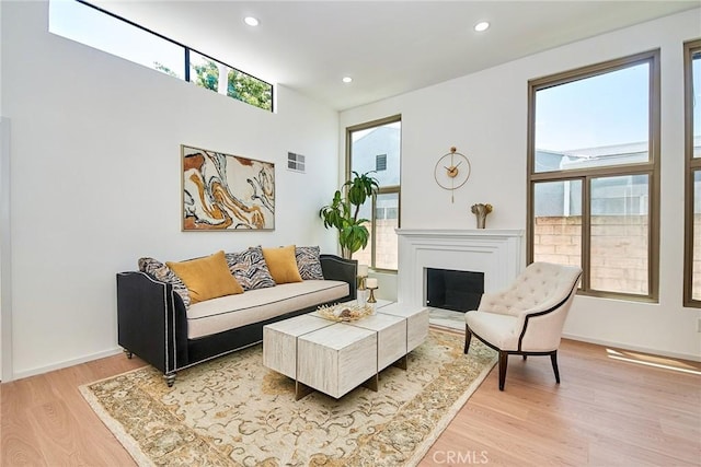 9539 Gladbeck Ave, Northridge, CA 91324 - living room featuring light wood-style floors, recessed lighting, a fireplace, and baseboards