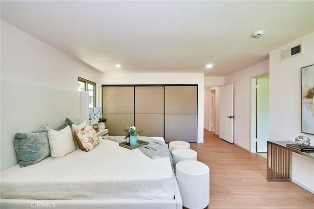 9539 Gladbeck Ave, Northridge, CA 91324 - bedroom with light wood-style flooring and recessed lighting