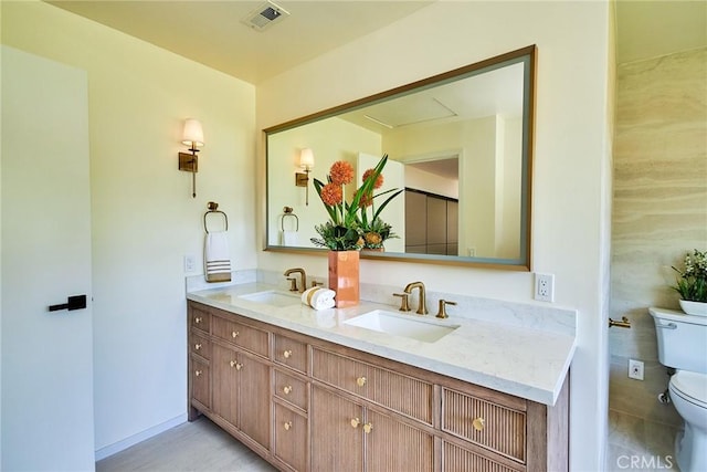 9539 Gladbeck Ave, Northridge, CA 91324 - full bathroom with toilet, double vanity, and baseboards