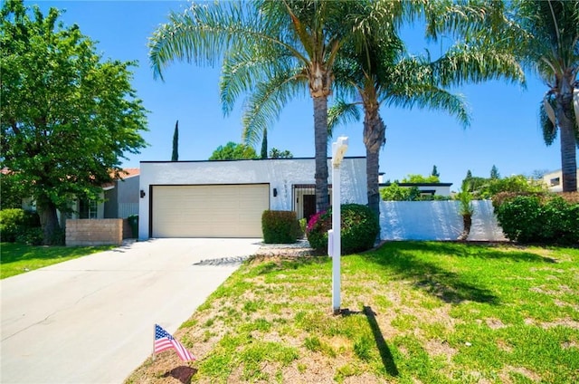 9539 Gladbeck Ave, Northridge, CA 91324 - view of front of house with an attached garage, stucco siding, and concrete driveway