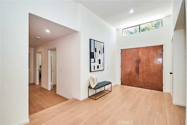 9539 Gladbeck Ave, Northridge, CA 91324 - foyer entrance featuring wood finished floors, a high ceiling, recessed lighting, and baseboards
