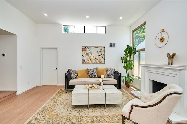9539 Gladbeck Ave, Northridge, CA 91324 - living area featuring wood finished floors, recessed lighting, baseboards, and a fireplace