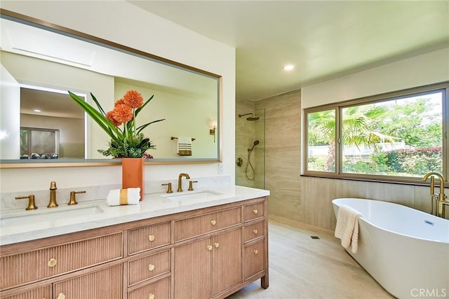 9539 Gladbeck Ave, Northridge, CA 91324 - bathroom featuring walk in shower, plenty of natural light, double vanity, a soaking tub, and recessed lighting