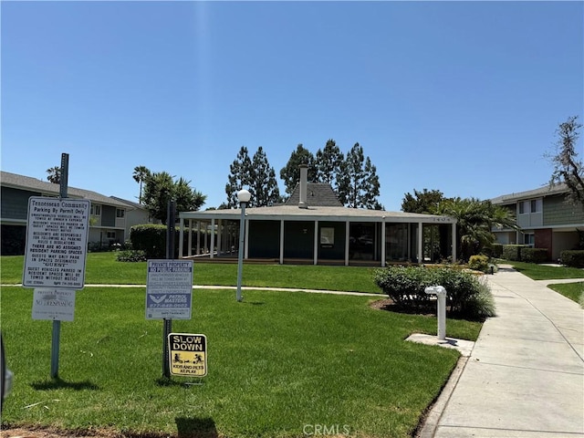 1404 N Tustin Ave Unit H1, Santa Ana, CA 92705 - view of front of property featuring a front yard