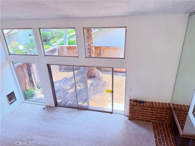 1404 N Tustin Ave Unit H1, Santa Ana, CA 92705 - doorway with carpet flooring and a textured ceiling