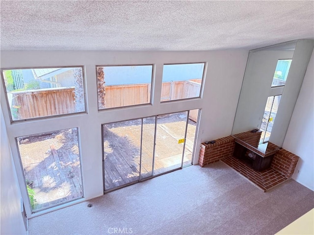 1404 N Tustin Ave Unit H1, Santa Ana, CA 92705 - unfurnished living room featuring carpet floors and a textured ceiling