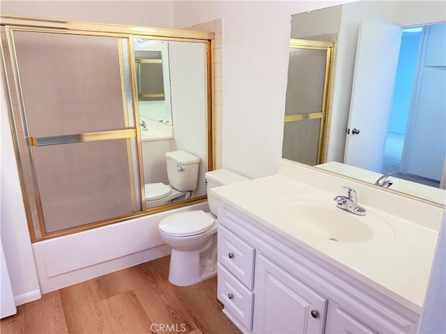 1404 N Tustin Ave Unit H1, Santa Ana, CA 92705 - full bath featuring wood finished floors, vanity, and shower / bath combination with glass door