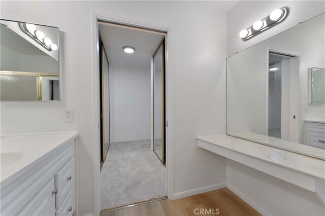 1404 N Tustin Ave Unit H1, Santa Ana, CA 92705 - full bathroom with vanity and wood finished floors