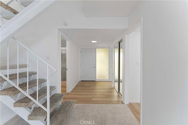 1404 N Tustin Ave Unit H1, Santa Ana, CA 92705 - entryway with stairway and wood finished floors