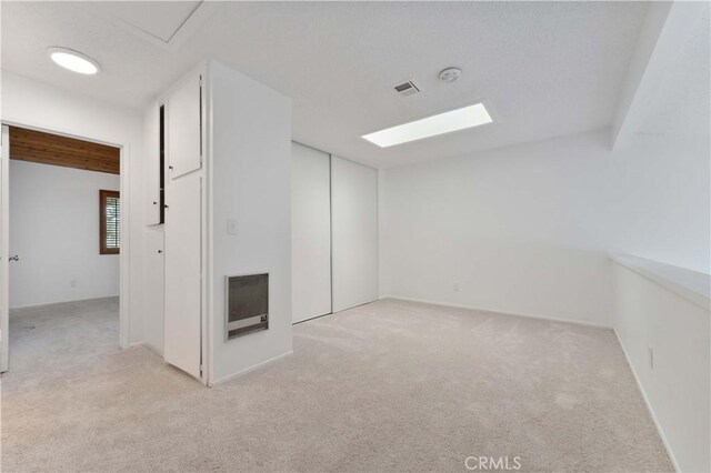 1404 N Tustin Ave Unit H1, Santa Ana, CA 92705 - unfurnished room featuring light carpet and heating unit