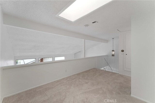 1404 N Tustin Ave Unit H1, Santa Ana, CA 92705 - carpeted spare room featuring a textured ceiling and baseboards