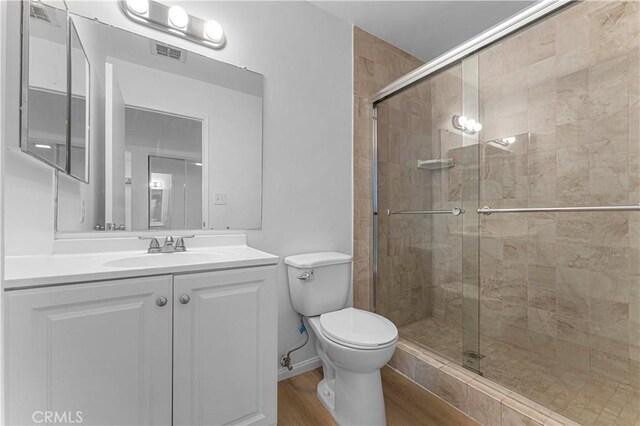 1404 N Tustin Ave Unit H1, Santa Ana, CA 92705 - full bath featuring a shower stall, vanity, and wood finished floors
