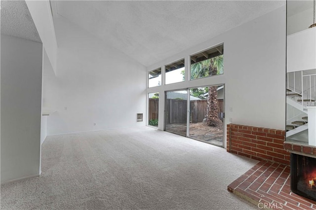 1404 N Tustin Ave Unit H1, Santa Ana, CA 92705 - carpeted spare room featuring high vaulted ceiling, a textured ceiling, and stairs