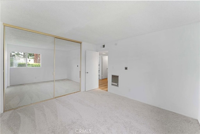 1404 N Tustin Ave Unit H1, Santa Ana, CA 92705 - unfurnished bedroom featuring carpet flooring and a closet