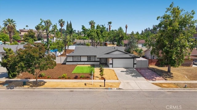 1208 Del Haven Ct, Redlands, CA 92374 - view of front facade with a garage, concrete driveway, and a residential view