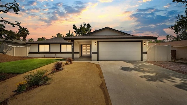 1208 Del Haven Ct, Redlands, CA 92374 - view of front of house with concrete driveway, stucco siding, and a garage