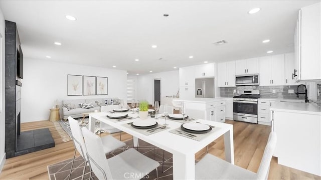 1208 Del Haven Ct, Redlands, CA 92374 - dining area featuring light wood-type flooring and recessed lighting