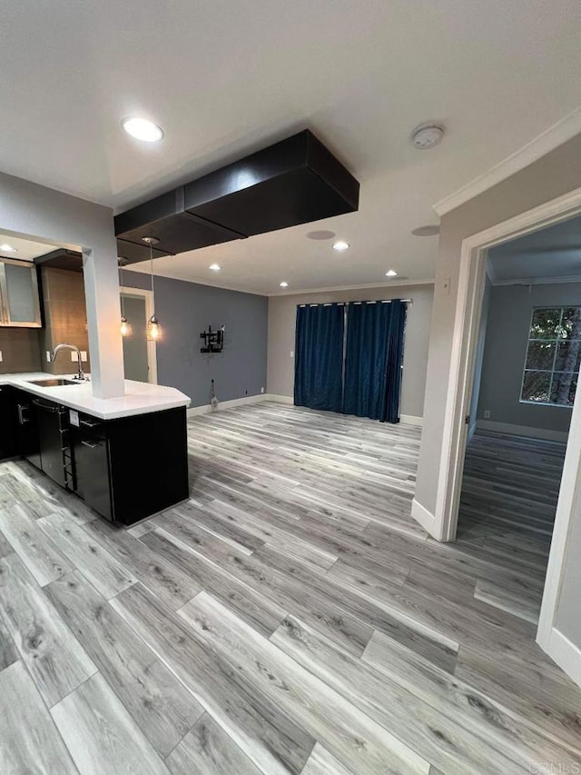 3078 Broadway Unit 107, San Diego, CA 92102 - kitchen featuring open floor plan, a sink, light countertops, light wood-style flooring, and recessed lighting