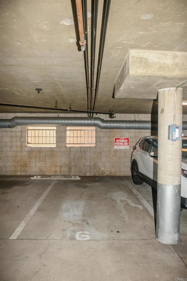 3078 Broadway Unit 107, San Diego, CA 92102 - parking deck featuring concrete block wall