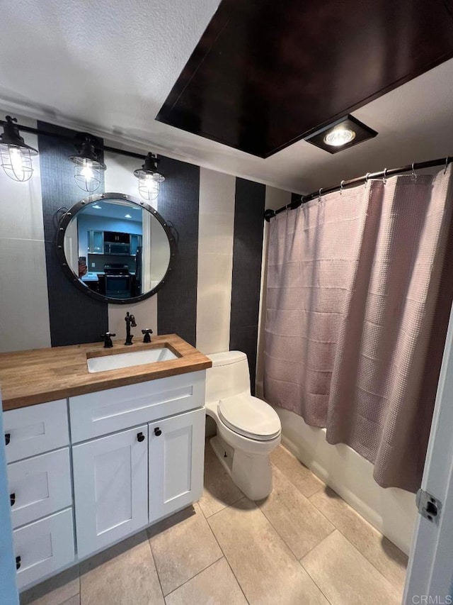 3078 Broadway Unit 107, San Diego, CA 92102 - full bathroom featuring toilet, vanity, tile patterned floors, and shower / bath combination with curtain