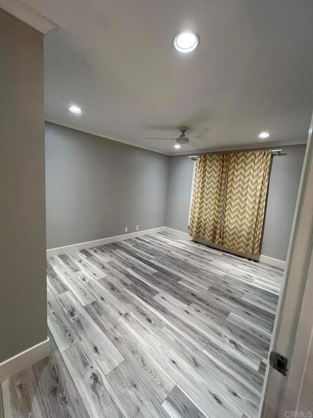 3078 Broadway Unit 107, San Diego, CA 92102 - spare room with a ceiling fan, recessed lighting, wood finished floors, and baseboards