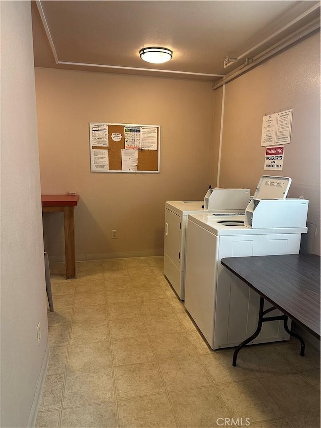 6330 Genesee Ave Unit 103, San Diego, CA 92122 - community laundry with baseboards and washing machine and clothes dryer