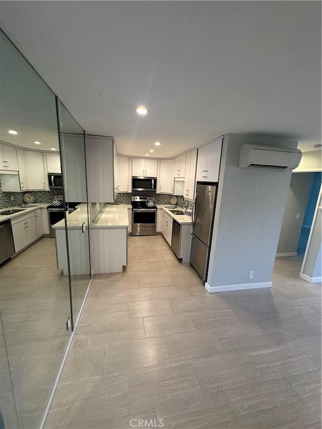 6330 Genesee Ave Unit 103, San Diego, CA 92122 - kitchen with stainless steel appliances, a wall mounted air conditioner, decorative backsplash, recessed lighting, and light countertops