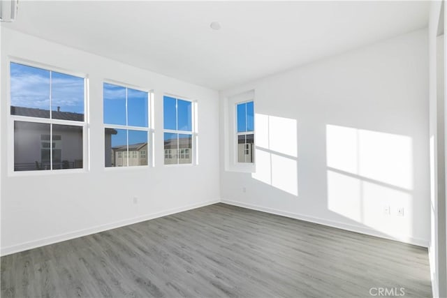 667 Limoncello Ln, Covina, CA 91723 - spare room with wood finished floors, baseboards, and plenty of natural light