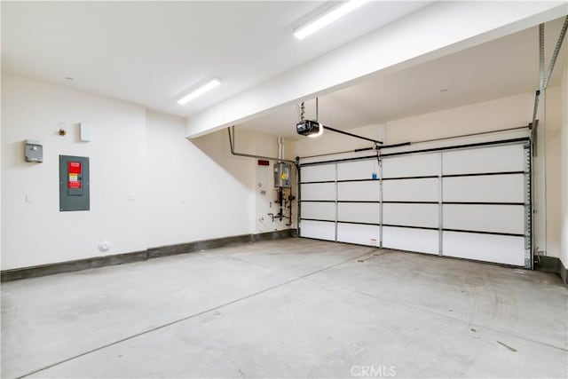 667 Limoncello Ln, Covina, CA 91723 - garage with electric panel, a garage door opener, water heater, and baseboards