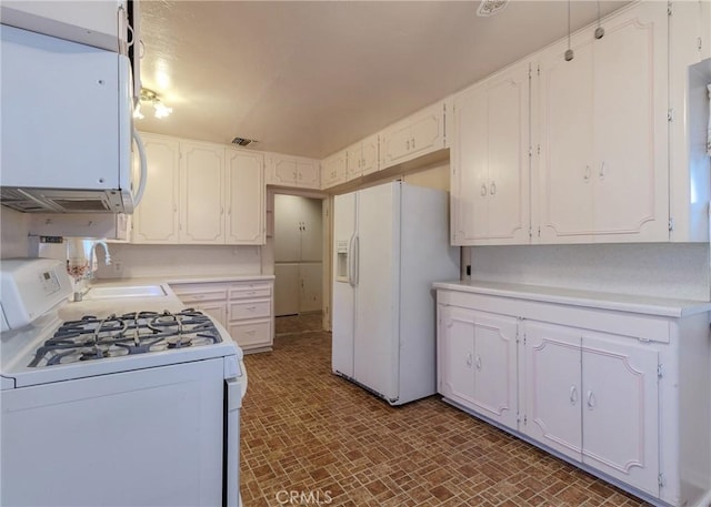 124 Mauna Loa Dr, Monrovia, CA 91016 - kitchen with white appliances, white cabinetry, and light countertops