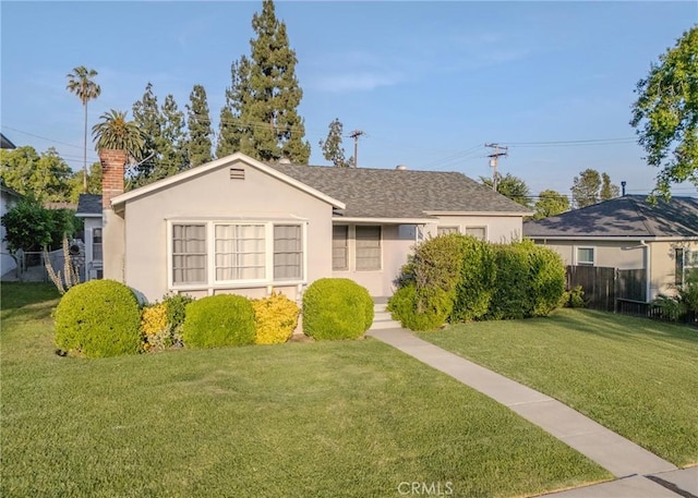124 Mauna Loa Dr, Monrovia, CA 91016 - view of front of home featuring stucco siding, a shingled roof, and a chimney