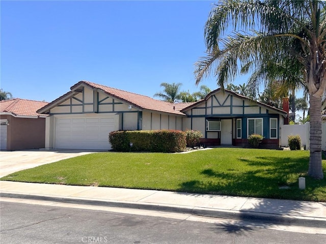 13941 Parkwood Dr, Fontana, CA 92337 - english style home featuring a garage, a tile roof, driveway, and stucco siding