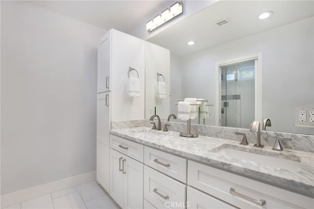24336 Hillview Dr, Laguna Niguel, CA 92677 - bathroom with double vanity, baseboards, tile patterned floors, a shower with door, and recessed lighting