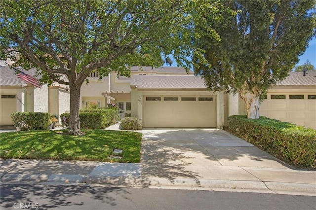 24336 Hillview Dr, Laguna Niguel, CA 92677 - view of front facade featuring stucco siding, an attached garage, concrete driveway, and a front yard